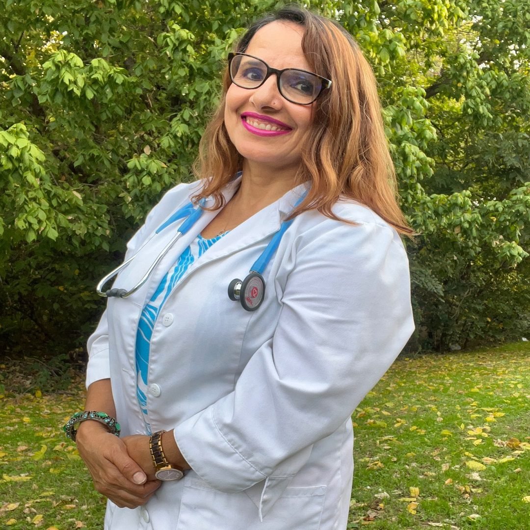 A professional portrait of Uma Adhikari, a dedicated healthcare provider at Denton Family Practice Clinic.